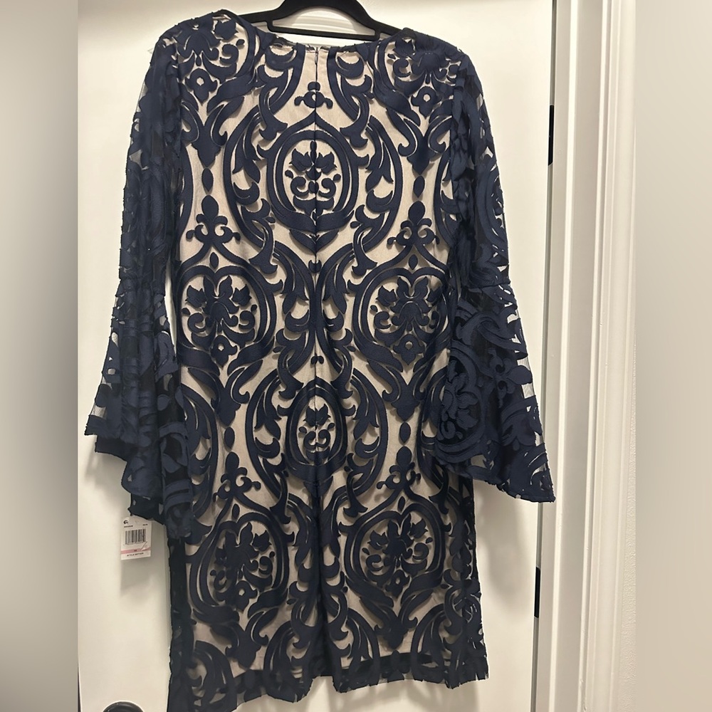 New with tags. Bell sleeve navy/cream dress.